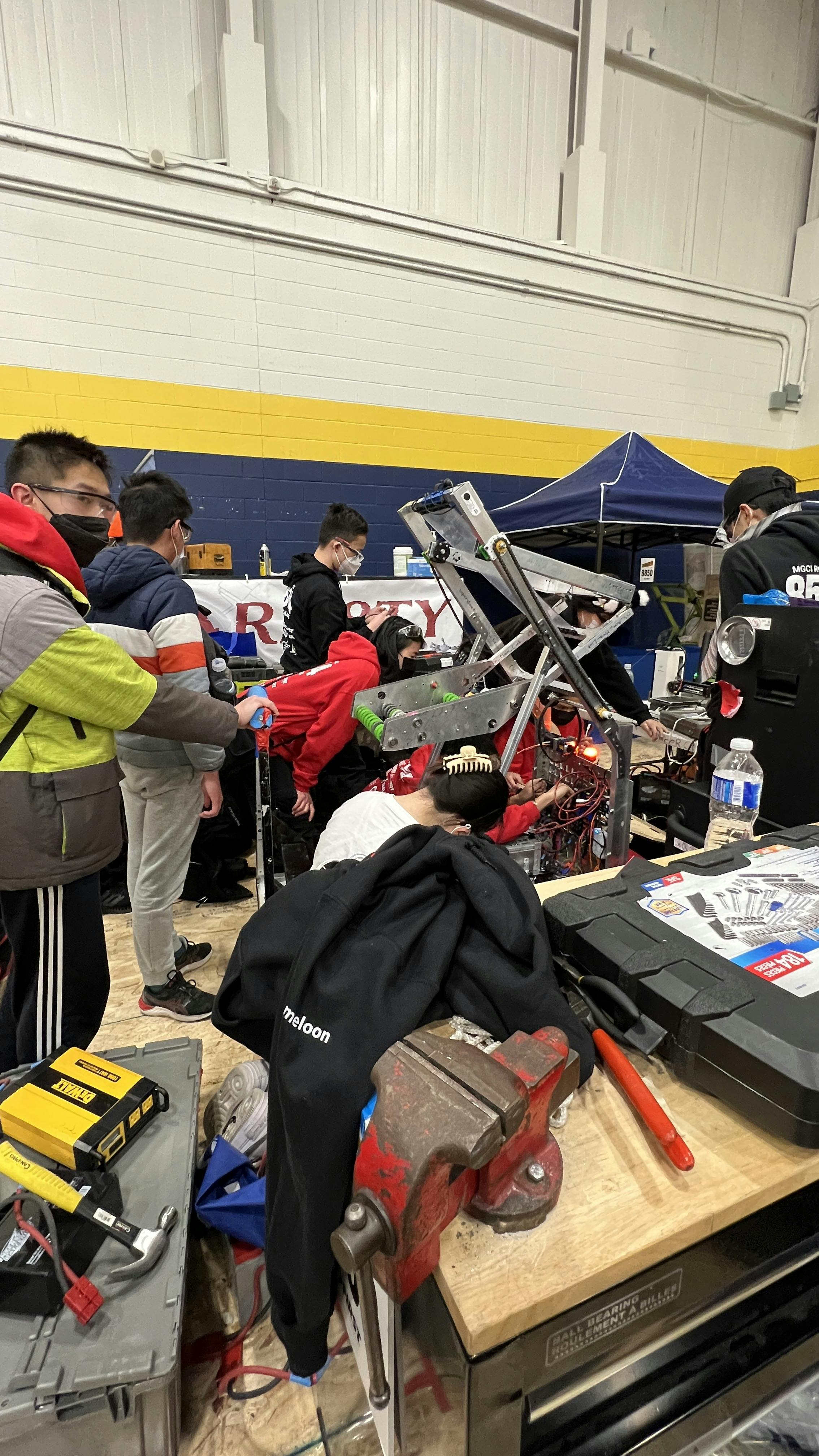 Team and robot in pit