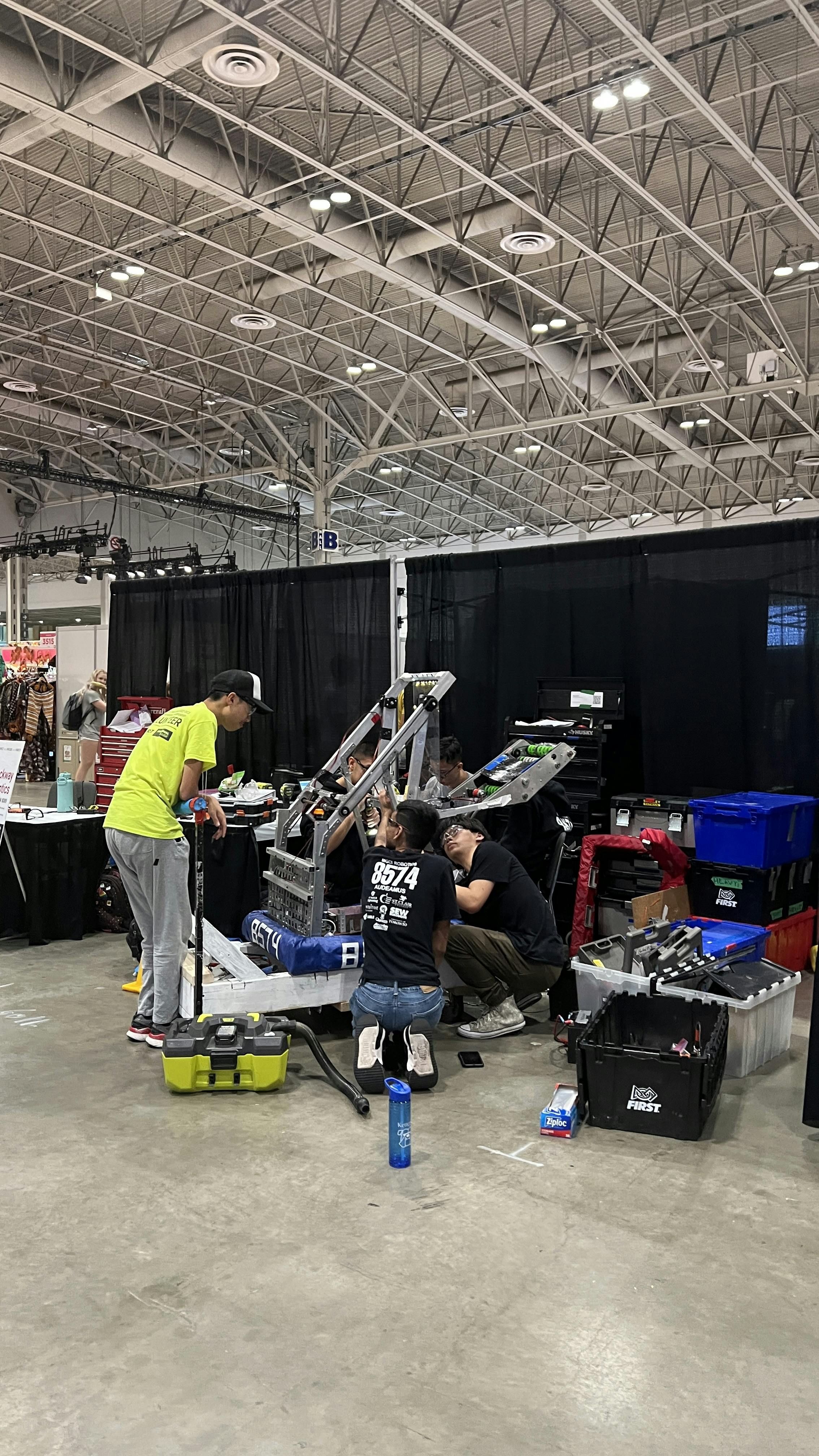 Team with robot in pit